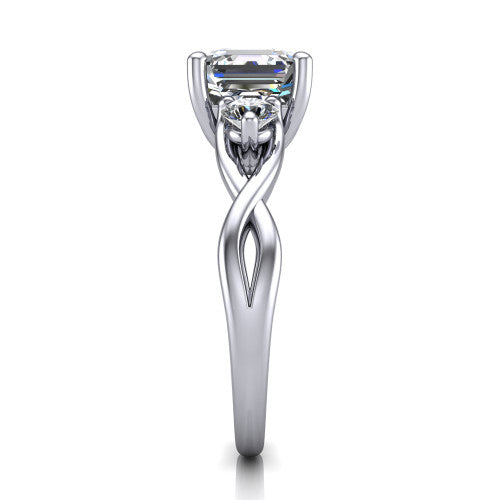Lydia square emerald three stone engagement ring in Platinum, side profile showing the round side diamonds, floral gallery, and woven infinity shank