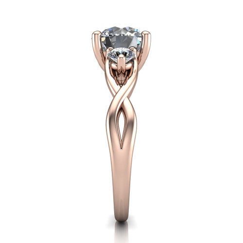 Lydia round three stone engagement ring in 14K Rose Gold, side profile showing the round side diamonds, floral gallery, and woven infinity shank