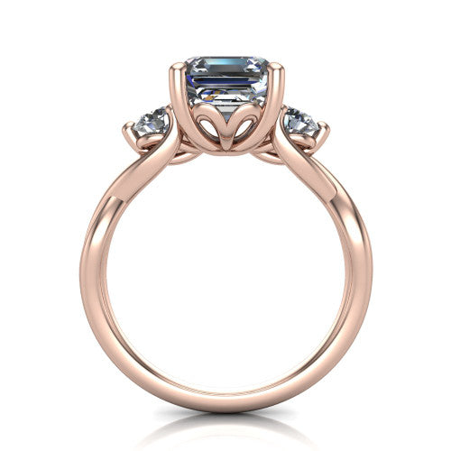Lydia square emerald three stone engagement ring in 18K Rose Gold, through-finger front profile showing the three-stone head, floral filigree under-gallery, and woven shank