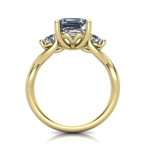 Lydia square emerald three stone engagement ring in 14K Yellow Gold, through-finger front profile showing the three-stone head, floral filigree under-gallery, and woven shank