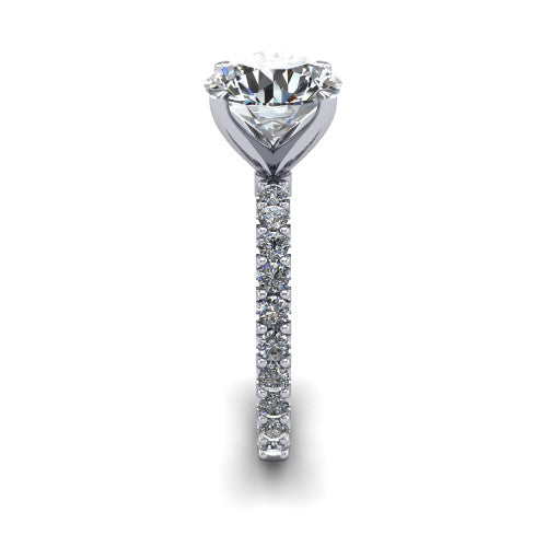 Elizabeth round solitaire engagement ring in 18K White Gold, side profile showing the pave diamonds running continuously around the shank