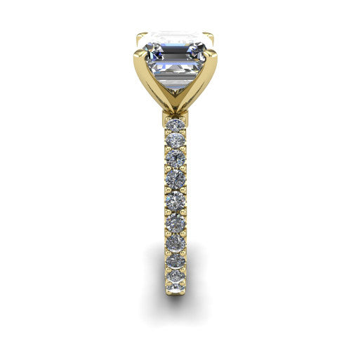 Elizabeth square emerald solitaire engagement ring in 18K Yellow Gold, side profile showing the pave diamonds running continuously around the shank