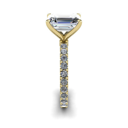 Elizabeth emerald solitaire engagement ring in 18K Yellow Gold, side profile showing the pave diamonds running continuously around the shank