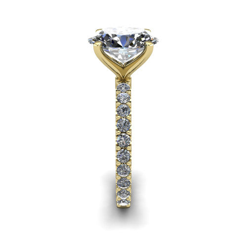 Elizabeth oval solitaire engagement ring in 18K Yellow Gold, side profile showing the pave diamonds running continuously around the shank
