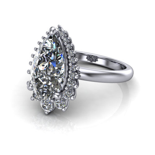 Matilda pear halo engagement ring in 14K White Gold, three-quarter perspective showing the brilliant pear-cut center diamond inside a sunburst halo of pointed rays with round accent diamonds clustered between them