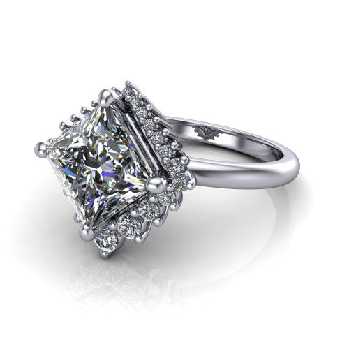 Matilda princess halo engagement ring in Platinum, three-quarter perspective showing the kite-set brilliant princess center diamond inside a sunburst halo of pointed rays with round accent diamonds clustered between them