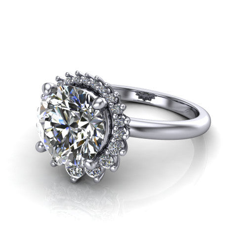 Matilda round halo engagement ring in 14K White Gold, three-quarter perspective showing the brilliant round center diamond inside a sunburst halo of pointed rays with round accent diamonds clustered between them