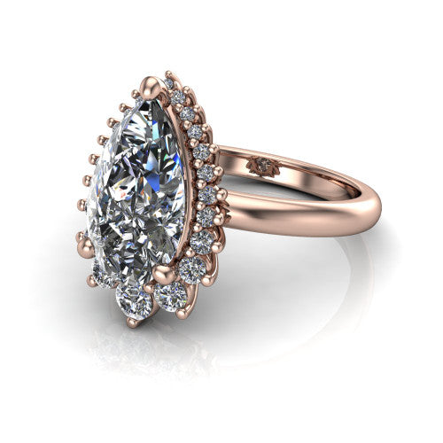 Matilda pear halo engagement ring in 18K Rose Gold, three-quarter perspective showing the brilliant pear-cut center diamond inside a sunburst halo of pointed rays with round accent diamonds clustered between them