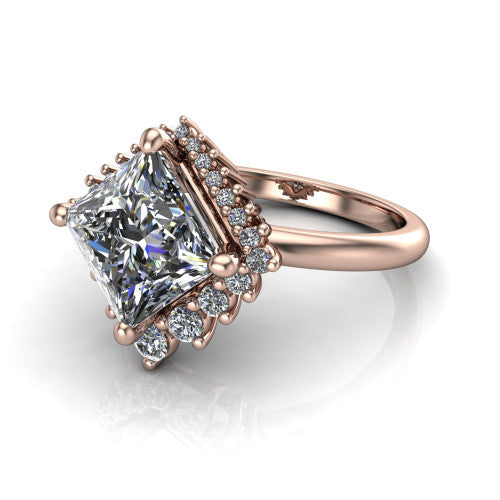 Matilda princess halo engagement ring in 14K Rose Gold, three-quarter perspective showing the kite-set brilliant princess center diamond inside a sunburst halo of pointed rays with round accent diamonds clustered between them