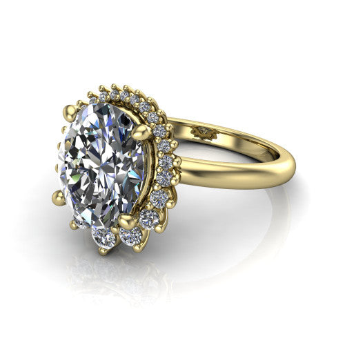 Matilda oval halo engagement ring in 18K Yellow Gold, three-quarter perspective showing the brilliant oval center diamond inside a sunburst halo of pointed rays with round accent diamonds clustered between them
