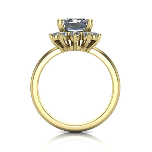 Matilda emerald halo engagement ring in 18K Yellow Gold, through-finger front profile showing the sunburst halo head and tall crown cathedral basket