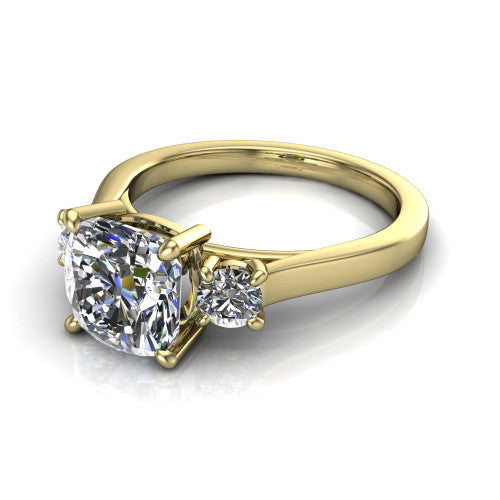 Olivia cushion three stone engagement ring in 14K Yellow Gold, three-quarter perspective showing the brilliant cushion-cut center diamond flanked by two round side diamonds on a squared flat-top shank