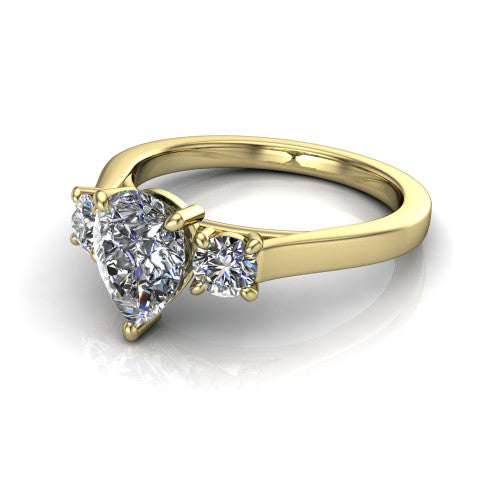 Olivia pear three stone engagement ring in 14K Yellow Gold, three-quarter perspective showing the brilliant pear-cut center diamond flanked by two round side diamonds on a squared flat-top shank
