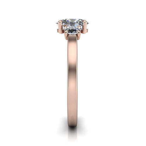 Olivia oval three stone engagement ring in 18K Rose Gold, side profile showing the squared flat-top shank and three-stone head