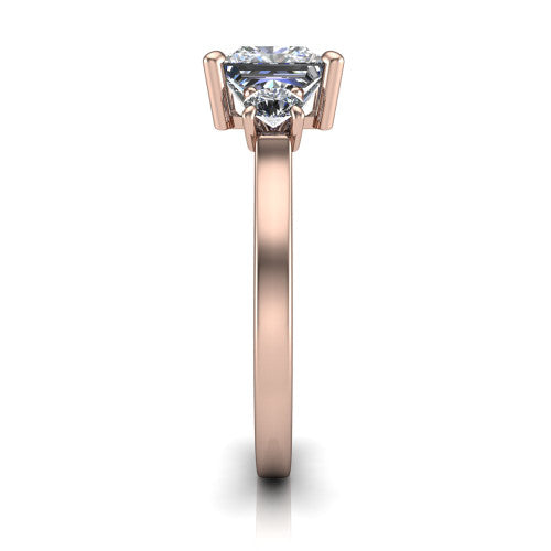 Olivia princess three stone engagement ring in 18K Rose Gold, side profile showing the squared flat-top shank and three-stone head