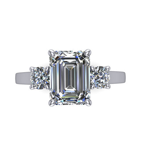 Olivia emerald three stone engagement ring in Platinum, top-down view showing the step-cut emerald center diamond with two matched round side diamonds
