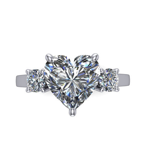 Olivia heart three stone engagement ring in Platinum, top-down view showing the brilliant heart-shaped center diamond with two matched round side diamonds