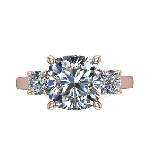 Olivia cushion three stone engagement ring in 18K Rose Gold, top-down view showing the brilliant cushion-cut center diamond with two matched round side diamonds