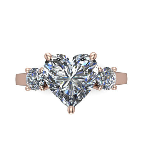 Olivia heart three stone engagement ring in 14K Rose Gold, top-down view showing the brilliant heart-shaped center diamond with two matched round side diamonds
