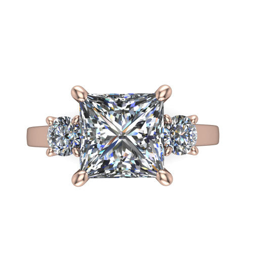 Olivia princess three stone engagement ring in 14K Rose Gold, top-down view showing the brilliant princess-cut center diamond with two matched round side diamonds