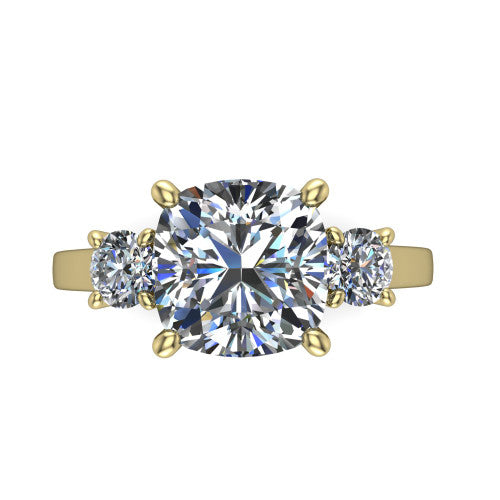 Olivia cushion three stone engagement ring in 14K Yellow Gold, top-down view showing the brilliant cushion-cut center diamond with two matched round side diamonds