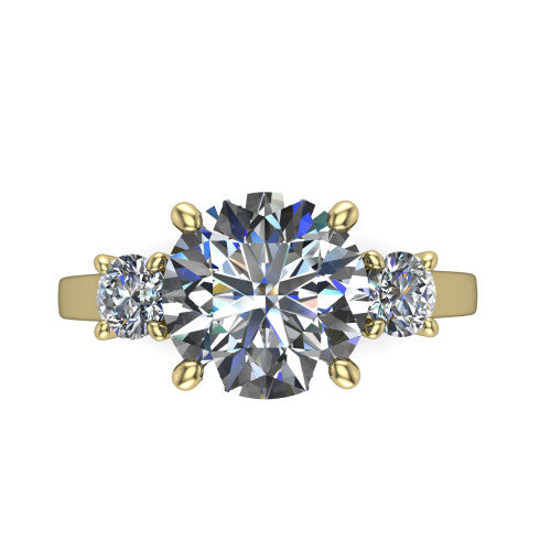 Olivia round three stone engagement ring in 18K Yellow Gold, top-down view showing the brilliant round center diamond with two matched round side diamonds