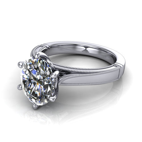 Adeline oval solitaire engagement ring in 14K White Gold, three-quarter perspective showing the brilliant oval center diamond on a wide flat-top milgrain band