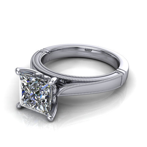 Adeline princess solitaire engagement ring in Platinum, three-quarter perspective showing the brilliant princess-cut center diamond on a wide flat-top milgrain band