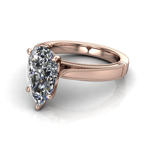 Adeline pear solitaire engagement ring in 14K Rose Gold, three-quarter perspective showing the brilliant pear-cut center diamond on a wide flat-top milgrain band
