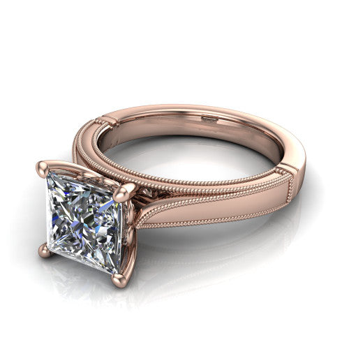 Adeline princess solitaire engagement ring in 14K Rose Gold, three-quarter perspective showing the brilliant princess-cut center diamond on a wide flat-top milgrain band