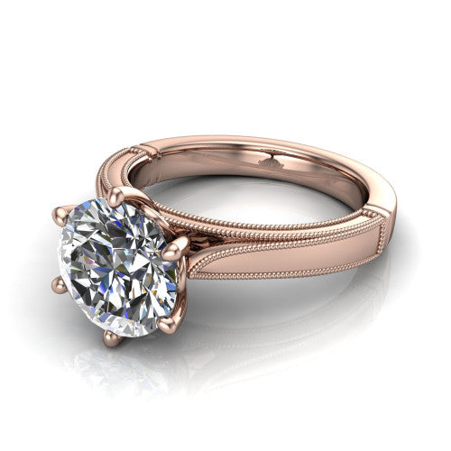 Adeline round solitaire engagement ring in 14K Rose Gold, three-quarter perspective showing the brilliant round center diamond on a wide flat-top milgrain band