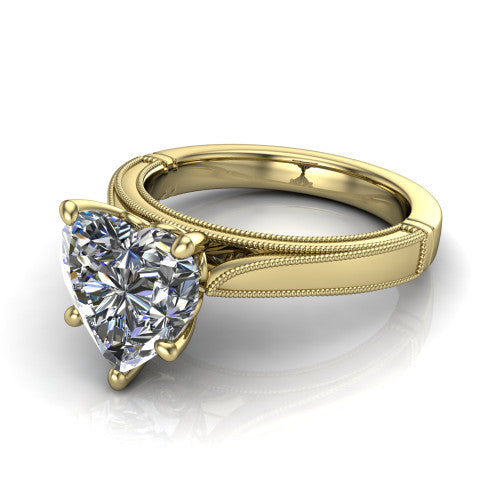 Adeline heart solitaire engagement ring in 18K Yellow Gold, three-quarter perspective showing the brilliant heart-shaped center diamond on a wide flat-top milgrain band
