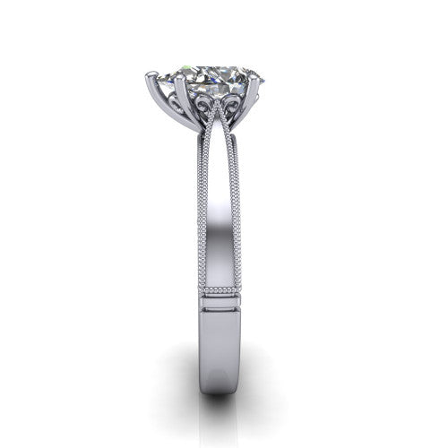 Adeline pear solitaire engagement ring in Platinum, side profile showing the wide flat-top band with milgrain bead borders along top and bottom