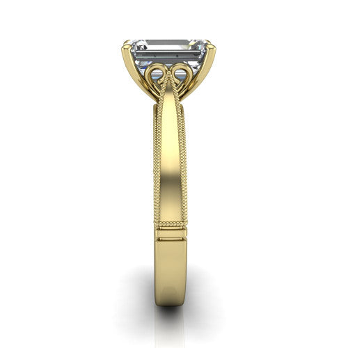 Adeline emerald solitaire engagement ring in 18K Yellow Gold, side profile showing the wide flat-top band with milgrain bead borders along top and bottom