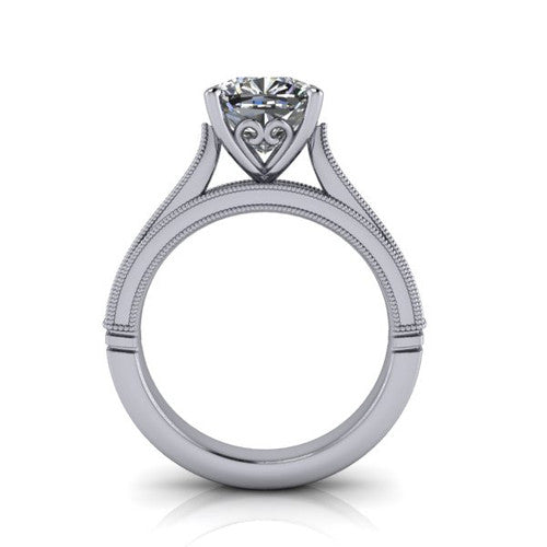 Adeline cushion solitaire engagement ring in Platinum, through-finger front profile showing the heart filigree under-gallery and milgrain band edges