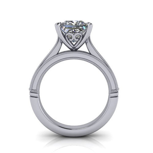 Adeline princess solitaire engagement ring in 18K White Gold, through-finger front profile showing the heart filigree under-gallery and milgrain band edges