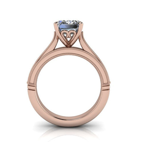 Adeline emerald solitaire engagement ring in 14K Rose Gold, through-finger front profile showing the heart filigree under-gallery and milgrain band edges