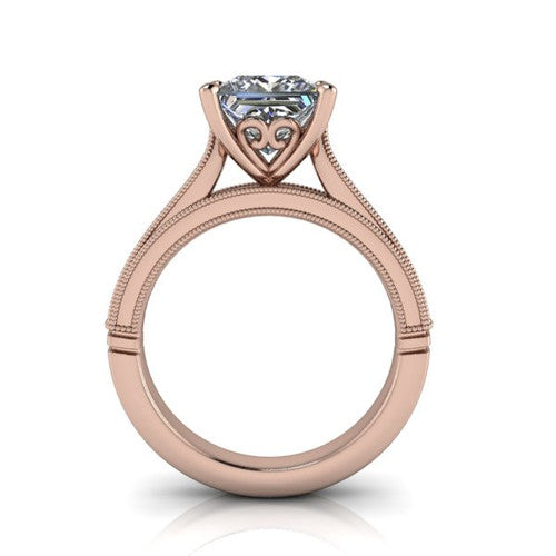 Adeline princess solitaire engagement ring in 18K Rose Gold, through-finger front profile showing the heart filigree under-gallery and milgrain band edges
