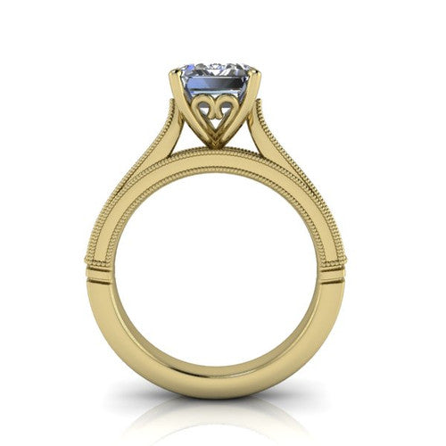 Adeline emerald solitaire engagement ring in 14K Yellow Gold, through-finger front profile showing the heart filigree under-gallery and milgrain band edges