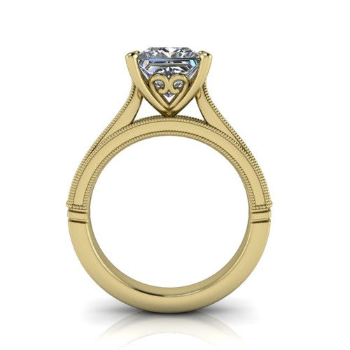 Adeline princess solitaire engagement ring in 18K Yellow Gold, through-finger front profile showing the heart filigree under-gallery and milgrain band edges