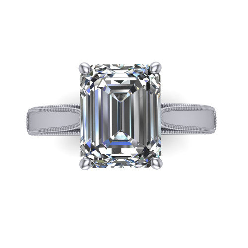Adeline emerald solitaire engagement ring in 18K White Gold, top-down view showing the step-cut emerald center diamond held by four prongs above a squared milgrain band
