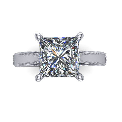 Adeline princess solitaire engagement ring in Platinum, top-down view showing the brilliant princess-cut center diamond held by four prongs above a squared milgrain band