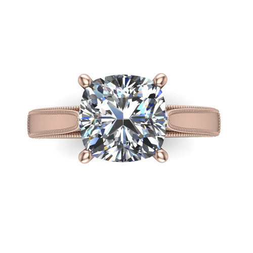 Adeline cushion solitaire engagement ring in 18K Rose Gold, top-down view showing the brilliant cushion-cut center diamond held by four prongs above a squared milgrain band