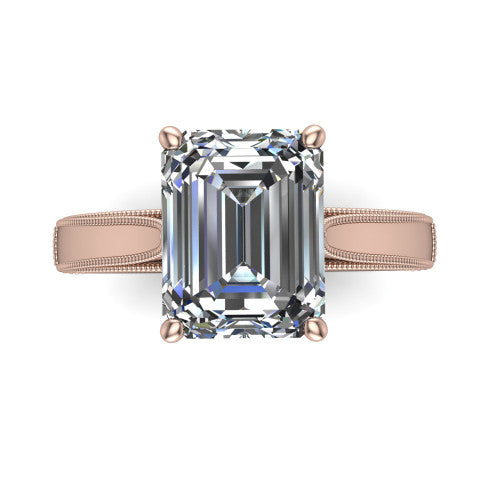 Adeline emerald solitaire engagement ring in 18K Rose Gold, top-down view showing the step-cut emerald center diamond held by four prongs above a squared milgrain band