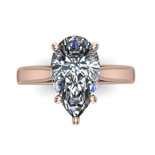 Adeline pear solitaire engagement ring in 18K Rose Gold, top-down view showing the brilliant pear-cut center diamond held by four prongs above a squared milgrain band