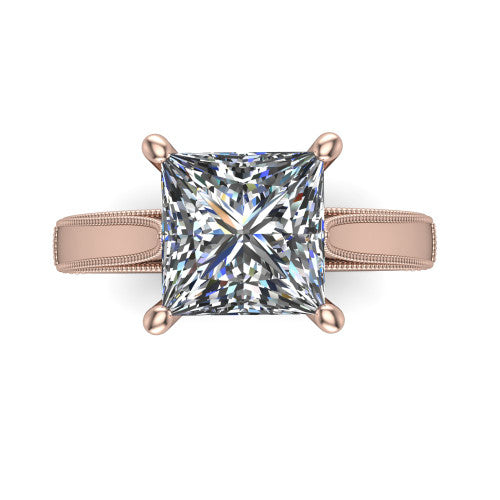 Adeline princess solitaire engagement ring in 18K Rose Gold, top-down view showing the brilliant princess-cut center diamond held by four prongs above a squared milgrain band