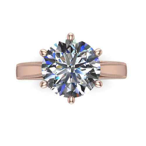 Adeline round solitaire engagement ring in 14K Rose Gold, top-down view showing the brilliant round center diamond held by four prongs above a squared milgrain band