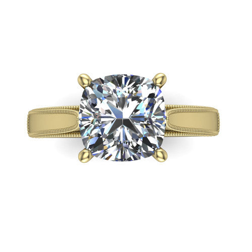 Adeline cushion solitaire engagement ring in 18K Yellow Gold, top-down view showing the brilliant cushion-cut center diamond held by four prongs above a squared milgrain band