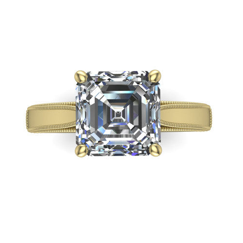 Adeline square emerald solitaire engagement ring in 14K Yellow Gold, top-down view showing the step-cut square emerald center diamond held by four prongs above a squared milgrain band