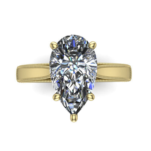 Adeline pear solitaire engagement ring in 14K Yellow Gold, top-down view showing the brilliant pear-cut center diamond held by four prongs above a squared milgrain band